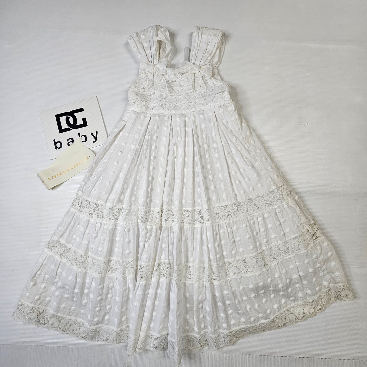 Vestito bimba Stefano Cavalleri bianco con pizzo e balze
