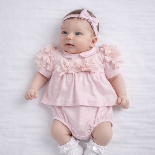 Pagliaccetto neonata rosa con dettagli floreali – TENERI & BELLI